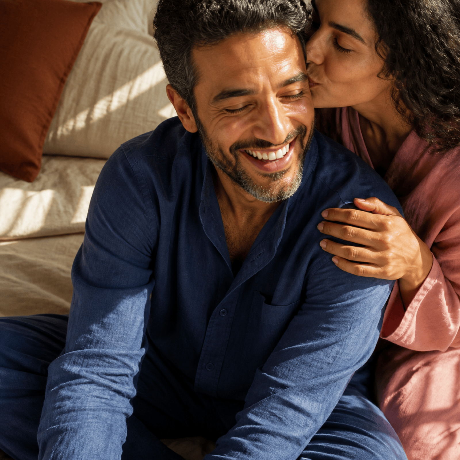 Egyptian couple sharing an affectionate relaxed moment at home